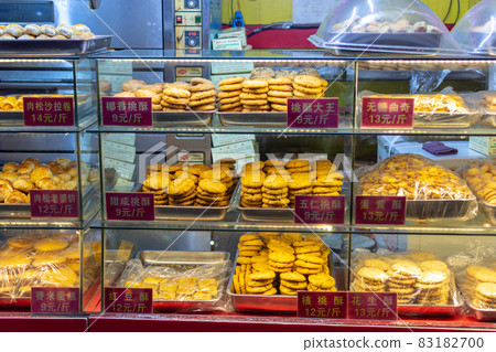 Traditional pastry and cookies on a street market food stall in Luoyang, China Traditional pastry and cookies on a street market food stall in Luoyang, China 83182700