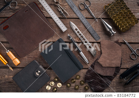 Leather products. Work place craftsman in a workshop. Top view 83184772