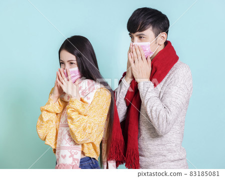 Young couple wearing masks  winter casual clothing 83185081