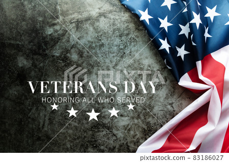 Veterans day. Honoring all who served. American flag on cement background Veterans day. Honoring all who served. American flag on cement background 83186027