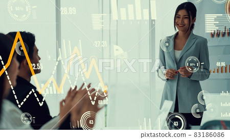 Business people in corporate staff meeting with envisional graphic Business people in corporate staff meeting with envisional graphic 83186086