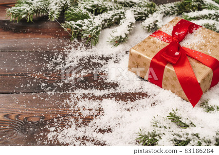 Wrapped gift for winter holidays background with copy space Wrapped gift for winter holidays background with copy space 83186284