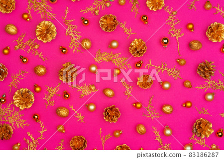 Pink background with Christmas holiday decorations pattern Pink background with Christmas holiday decorations pattern 83186287