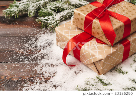 Wrapped gift for winter holidays background with copy space Wrapped gift for winter holidays background with copy space 83186290