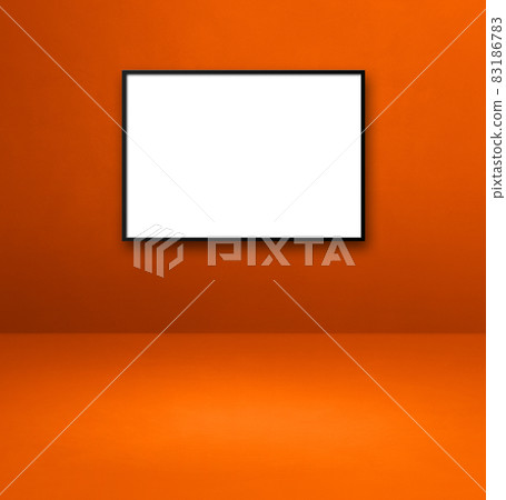 Black picture frame hanging on an orange wall Black picture frame hanging on an orange wall 83186783