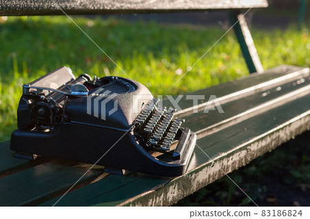 Antique vintage typewriter in on autumn background 83186824