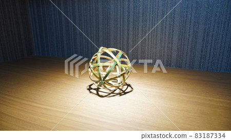 Traditional Japanese work made of bamboo illuminated by the spotlight Traditional Japanese work made of bamboo illuminated by the spotlight 83187334