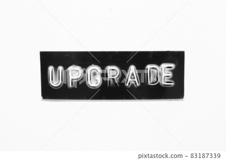 Black color banner that have embossed letter with word upgrade on white paper background Black color banner that have embossed letter with word upgrade on white paper background 83187339