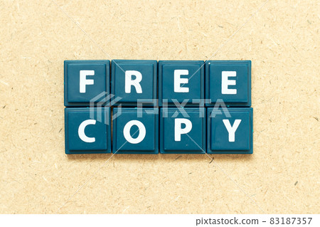 Tile alphabet letter in word free copy on wood background 83187357