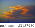 A Sailing Boat with orange sunset cloud A Sailing Boat with orange sunset cloud 83187980