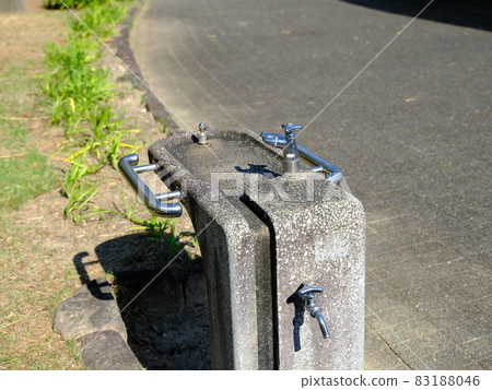 Water supply station installed on the sidewalk 83188046