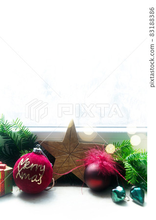 Christmas decorations on windowsil 83188386