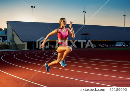 Runner sprinting towards success on run path running athletic track. Goal achievement concept. 83189090