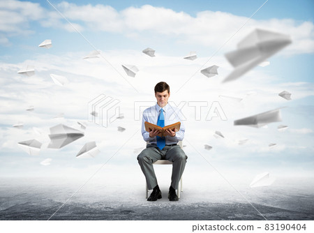 young businessman with book young businessman with book 83190404