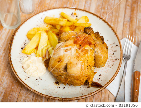Baked chicken legs with potatoes 83191350