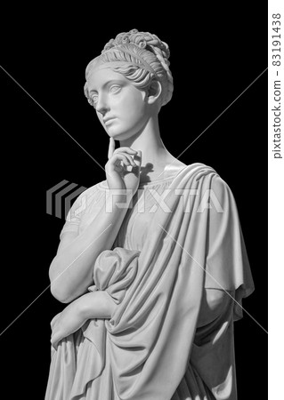 Gypsum copy of ancient statue of thinking young lady isolated on black background. Side view of plaster sculpture woman face Gypsum copy of ancient statue of thinking young lady isolated on black background. Side view of plaster sculpture woman face 83191438