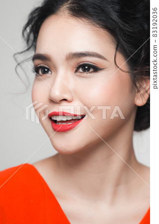 Fashion portrait of asian woman with elegant hairstyle. Perfect makeup. Fashion portrait of asian woman with elegant hairstyle. Perfect makeup. 83192036