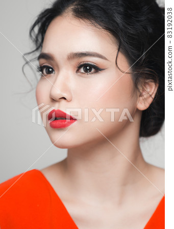 Fashion portrait of asian woman with elegant hairstyle. Perfect makeup. Fashion portrait of asian woman with elegant hairstyle. Perfect makeup. 83192038