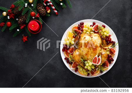 Christmas turkey. Roast Christmas turkey garnished for holiday Christmas dinner. Traditional food for Christmas dinner. 83192956