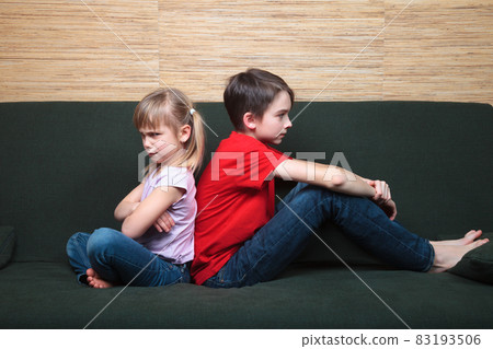 Siblings sulking after fight Siblings sulking after fight 83193506