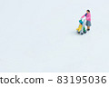 A woman strolling a stroller 83195036