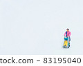 A woman strolling a stroller 83195040