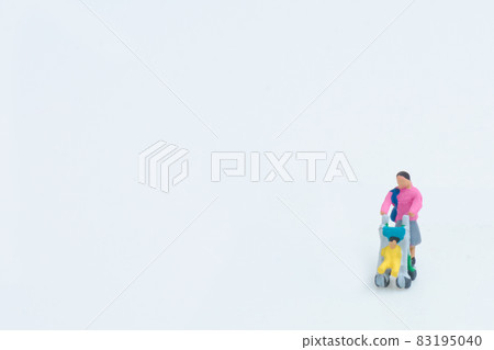 A woman strolling a stroller 83195040