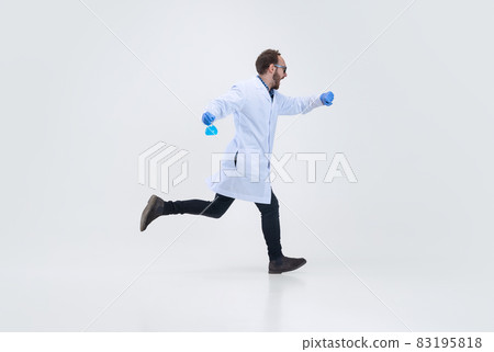Portrait of running man, chemist, doctor in action and motion isolated on white background. Concept of healthcare, pharmaceuticals, medicine 83195818