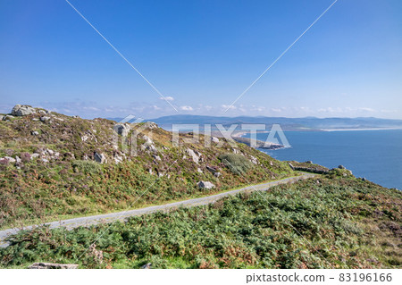 Road next to the viewpoint between Marmeelan and Crohy Head, Dungloe - County Donegal - Ireland. Road next to the viewpoint between Marmeelan and Crohy Head, Dungloe - County Donegal - Ireland. 83196166