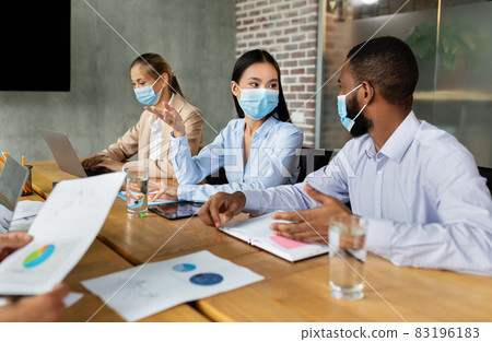 Diverse Business People In Protective Face Mask Attending Conference In Office 83196183
