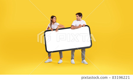 Couple holding big white empty smartphone screen 83196221