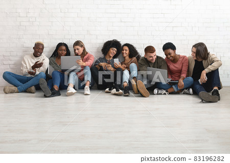 Creative students multiracial men and women working on project Creative students multiracial men and women working on project 83196282