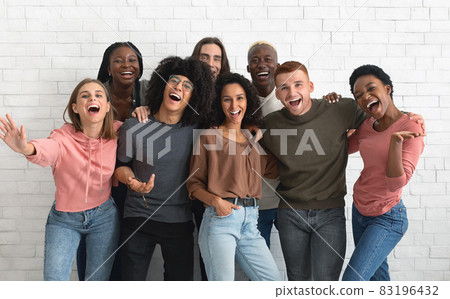 Emotional multiracial friends millennials posing together on white Emotional multiracial friends millennials posing together on white 83196432