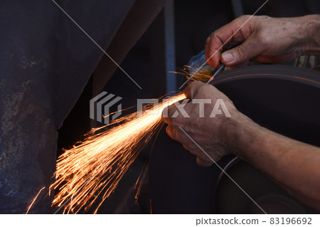 Sparks scattered during the sharpening work of Tanegashima scissors Sparks scattered during the sharpening work of Tanegashima scissors 83196692