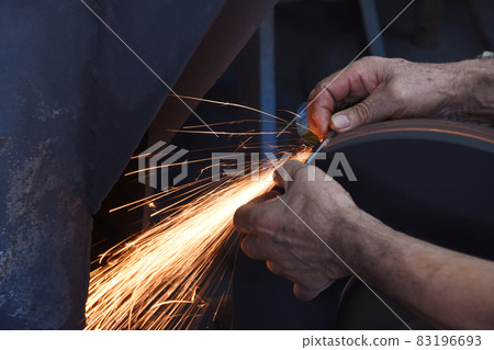 Sparks scattered during the sharpening work of Tanegashima scissors Sparks scattered during the sharpening work of Tanegashima scissors 83196693