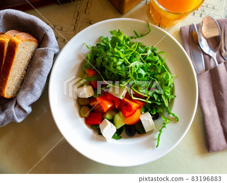Traditional greek vegetable salad with cheese feta and olives 83196883