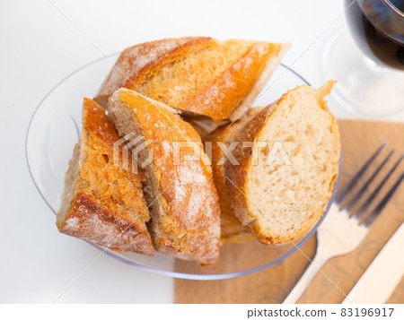 Baguette served with serving pieces Baguette served with serving pieces 83196917