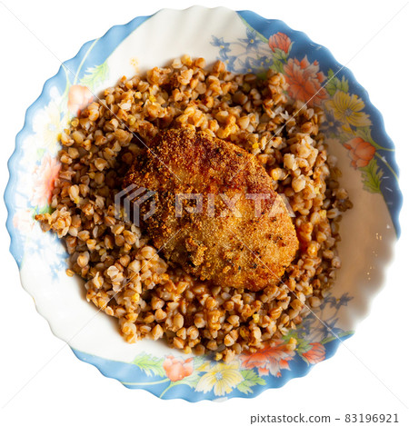 Appetizing buckwheat porridge with cutlet on plate. Healthy food. Russian cuisine Appetizing buckwheat porridge with cutlet on plate. Healthy food. Russian cuisine 83196921