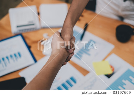 Female hands shaking at meeting making partnership deal, businesswomen handshaking as concept of respect, successful teamwork, collaboration and support, women power in business, top close up view. Female hands shaking at meeting making partnership deal, businesswomen handshaking as concept of respect, successful teamwork, collaboration and support, women power in business, top close up view. 83197609