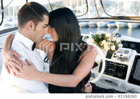 elegant couple in a yacht 83198260
