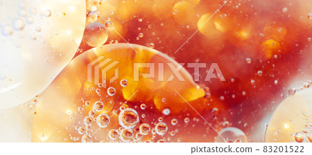 Oil bubbles close up. circles of water macro. abstract orange and fiery red background. banner 83201522