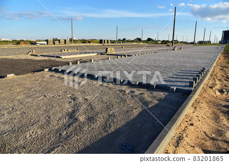 Laying paving slabs at construction site. Laying paving slabs at construction site. 83201865