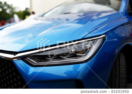 Headlight. LED headlamp of a modern car. Frontal lighting of highway vehicles Headlight. LED headlamp of a modern car. Frontal lighting of highway vehicles 83201950
