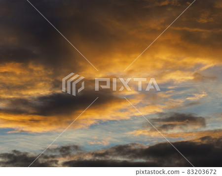 Clouds shining golden in the sun Clouds shining golden in the sun 83203672