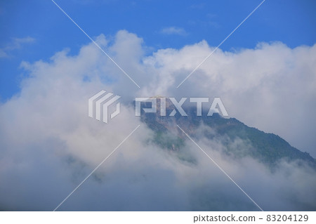 Scenery of Mt. Yake seen through the clouds @ Kamikochi, Nagano Scenery of Mt. Yake seen through the clouds @ Kamikochi, Nagano 83204129