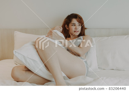 Sexy woman feels relax on the bed alone in the room. 83206440