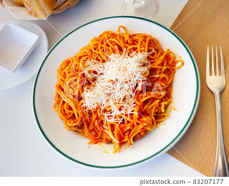 Italian spaghetti bolognese served with grated Parmesan Italian spaghetti bolognese served with grated Parmesan 83207177