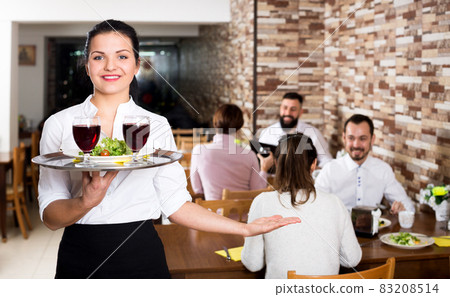 Female waiter showing country restaurant 83208514