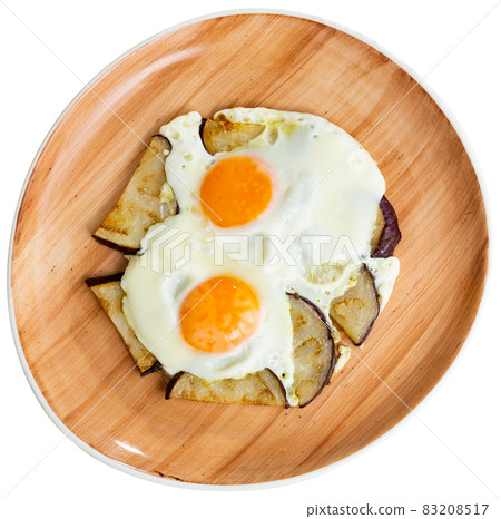 Delicious breakfast - scrambled eggs with fried eggplant closeup Delicious breakfast - scrambled eggs with fried eggplant closeup 83208517