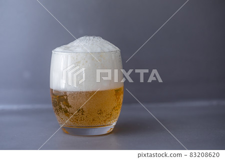 Beer that shines on a gray background Beer that shines on a gray background 83208620
